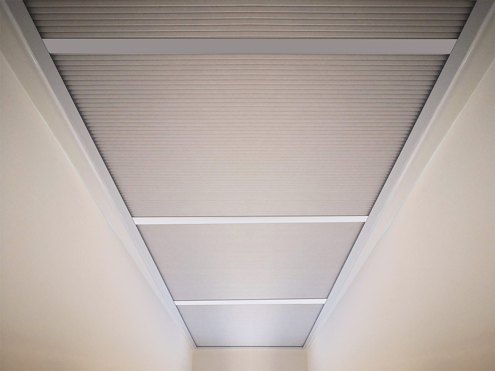 Cellular skylight blind fitted across a kitchen roof lantern