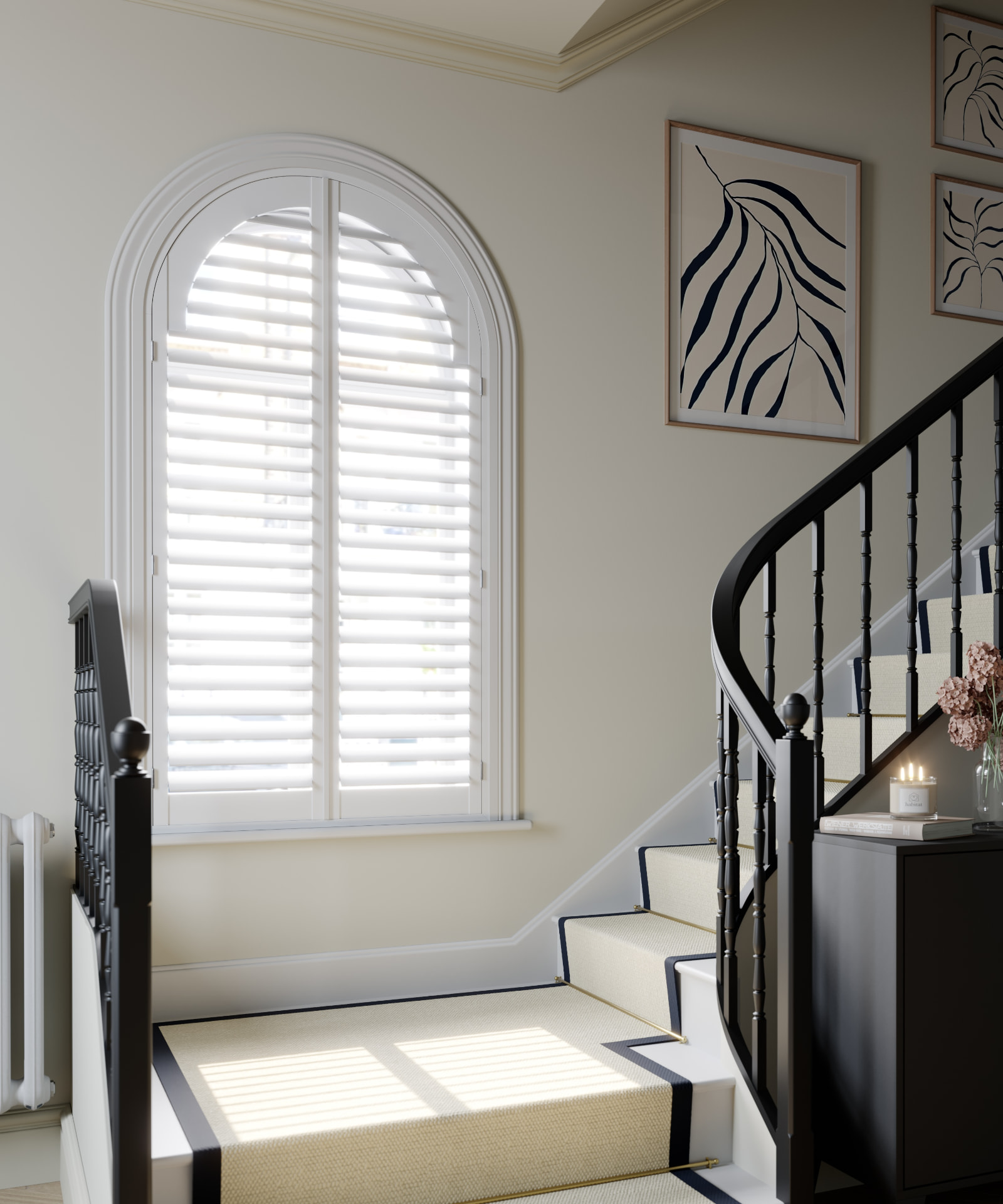 Arched landing window with vivid white full height shutters and 76mm louvres