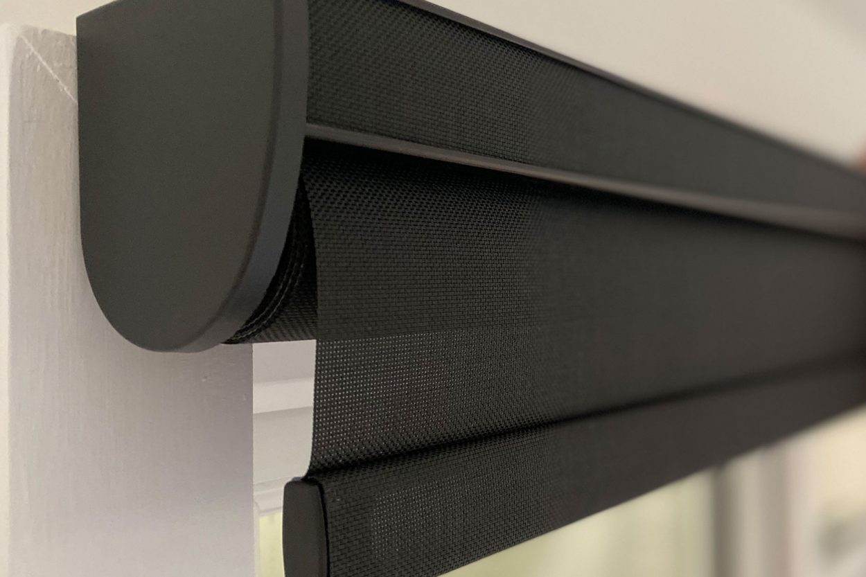 Close-up of a charcoal roller blind in a cassette headrail