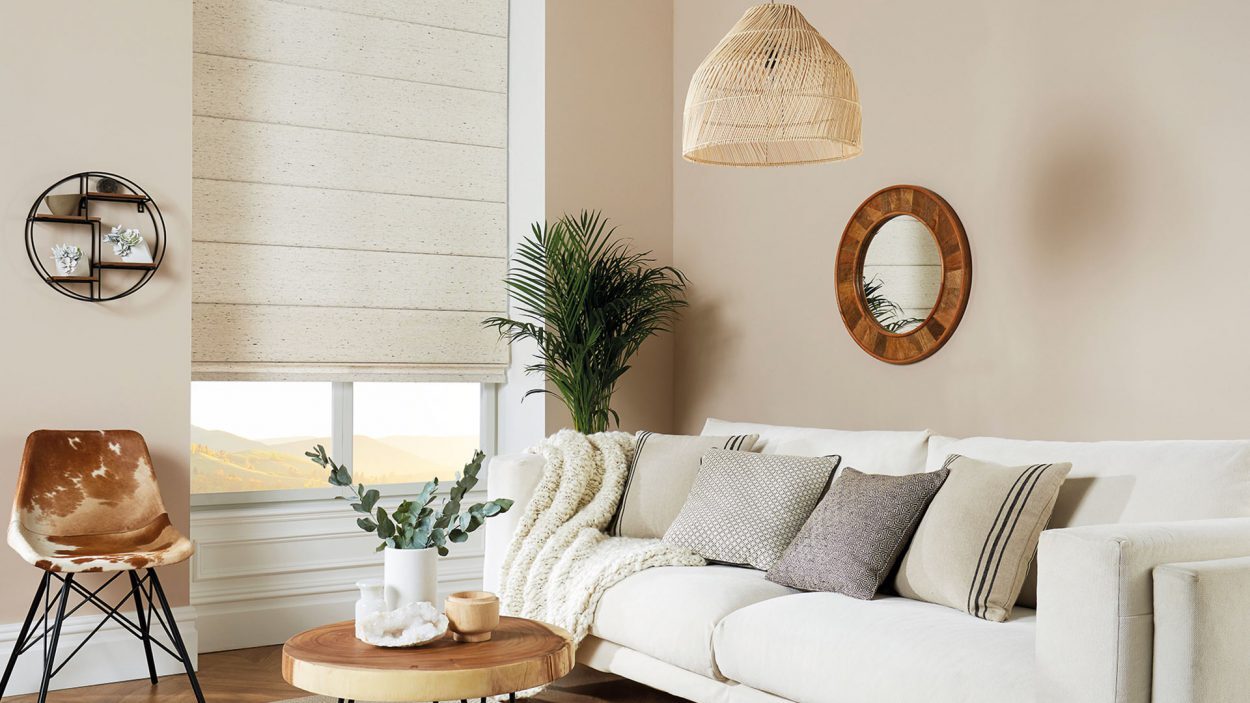 Cream roman blind in a bright living room