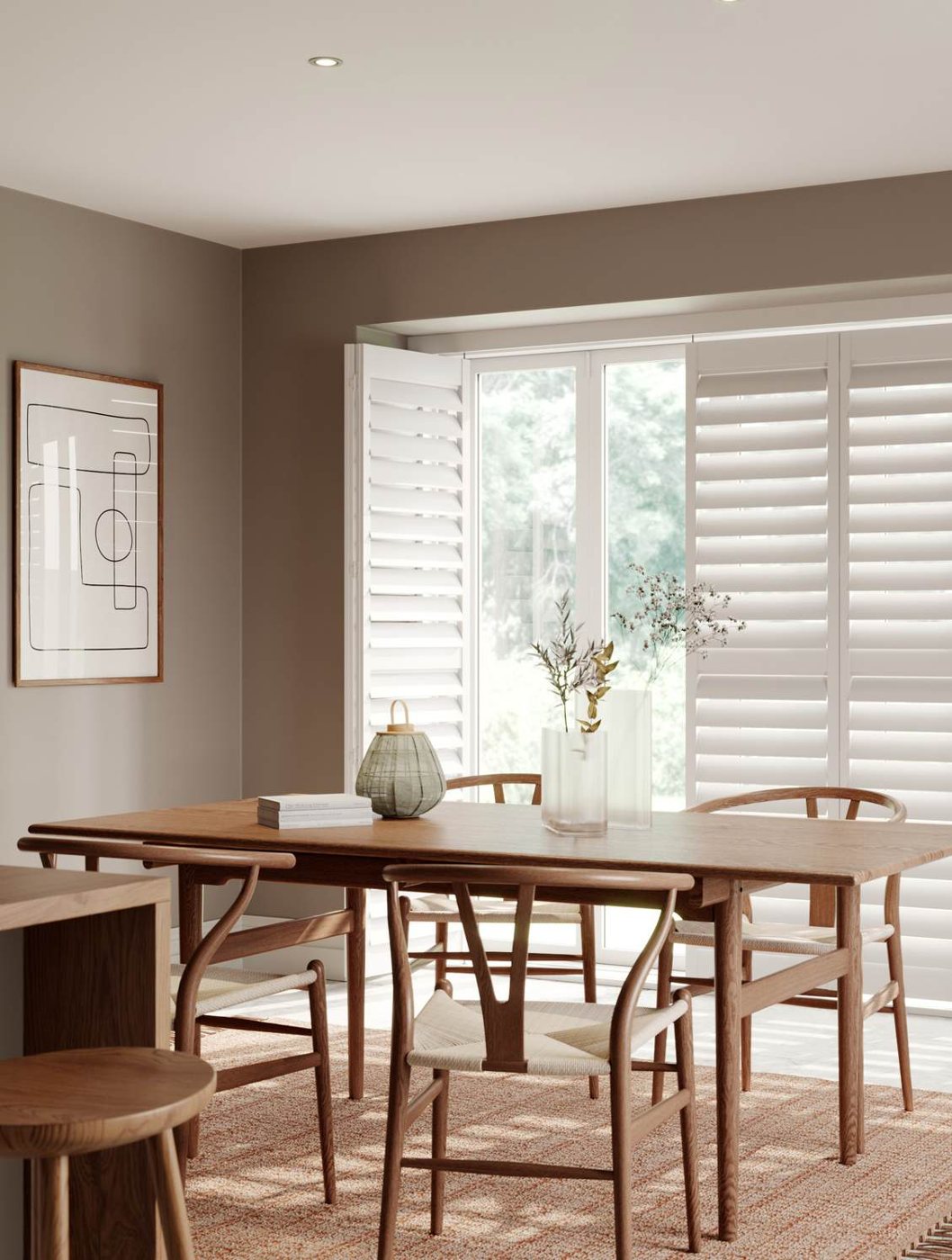 Tracked shutters across bi-fold doors