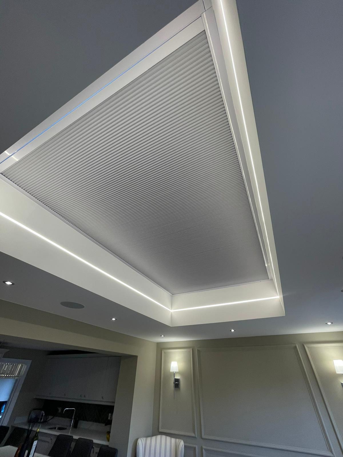 Roof lantern blind in a Mercury Ash fabric with cove lighting