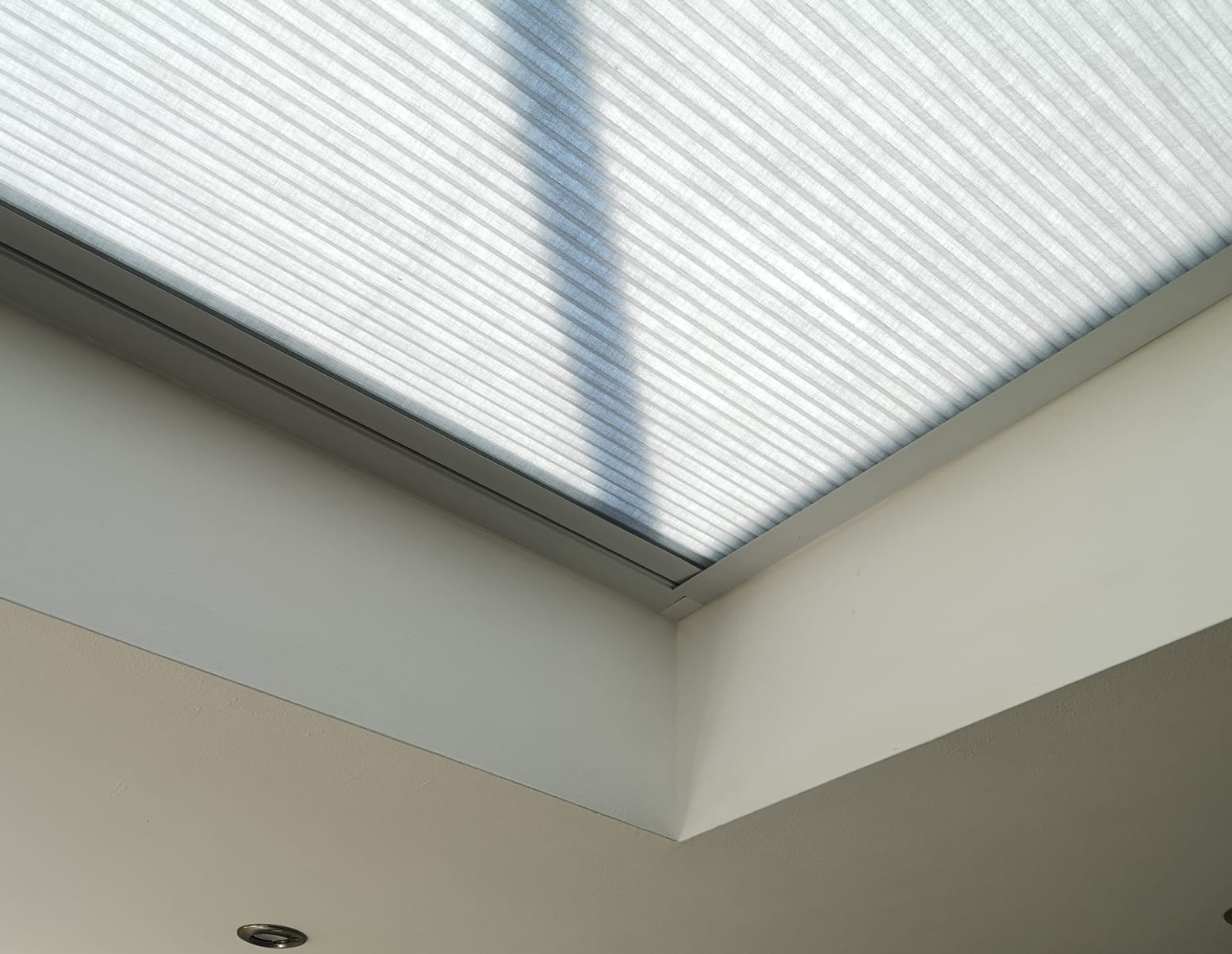Close-up of the slim side channel on a skylight blind