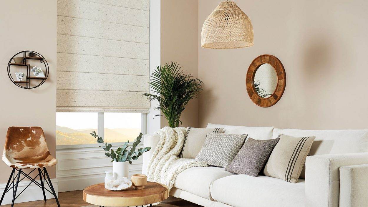 Cream roman blind in a bright living room