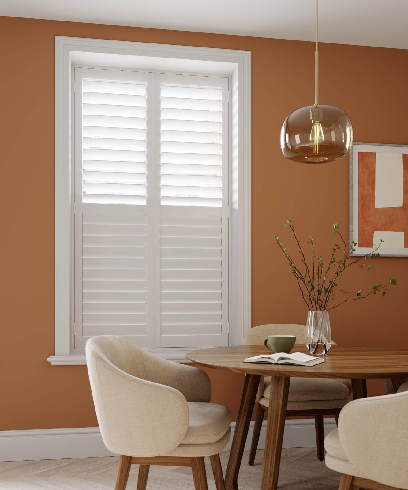 Snow white full height shutters with 89mm louvres in a terracotta dining room