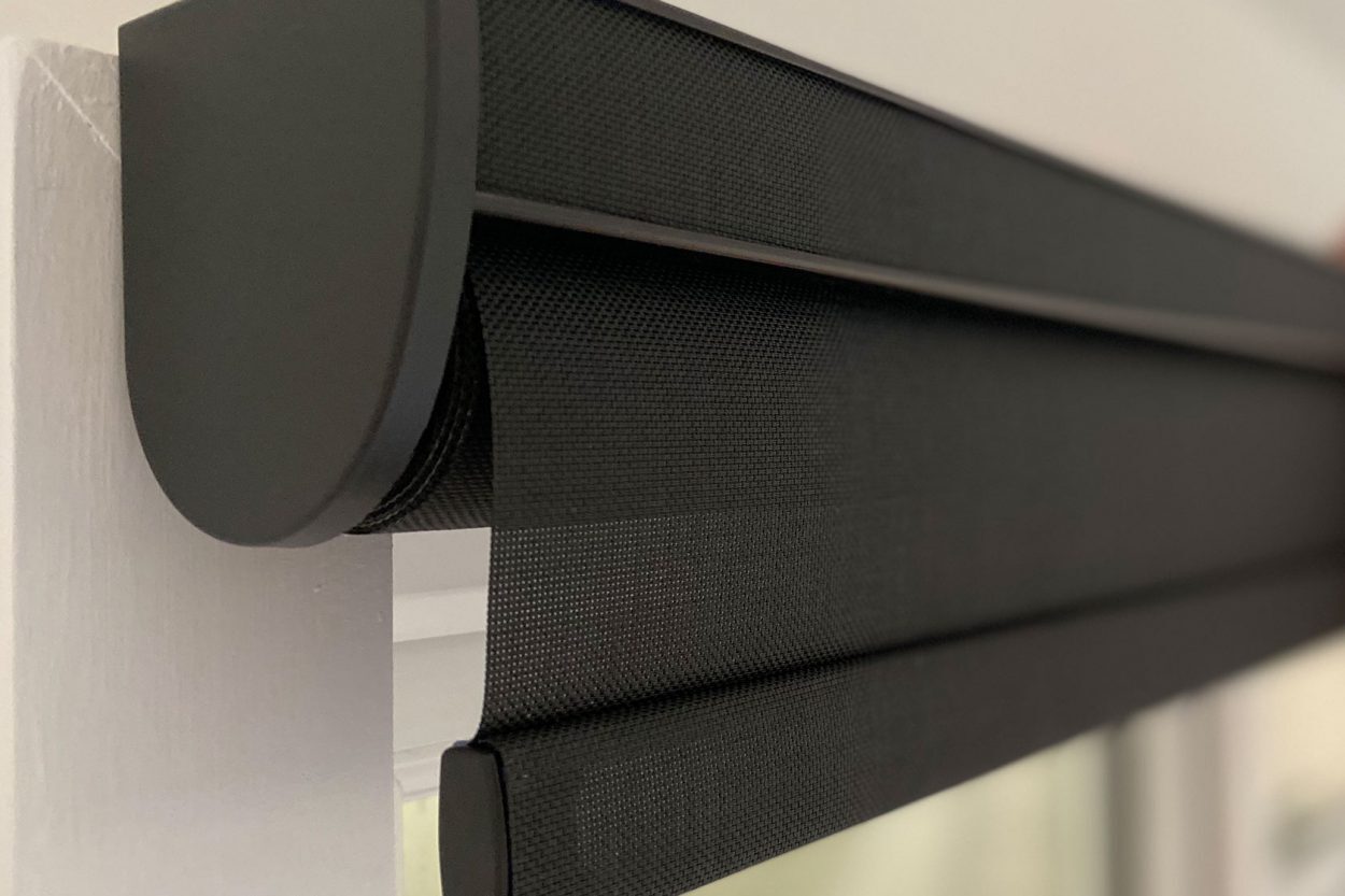 Close-up of a charcoal roller blind in a cassette headrail