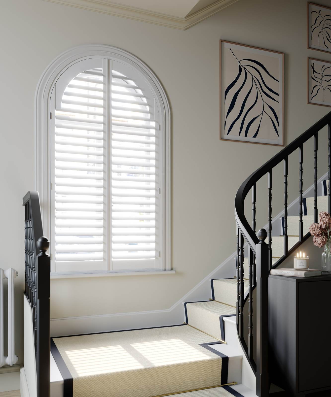 Arched landing window with vivid white full height shutters and 76mm louvres