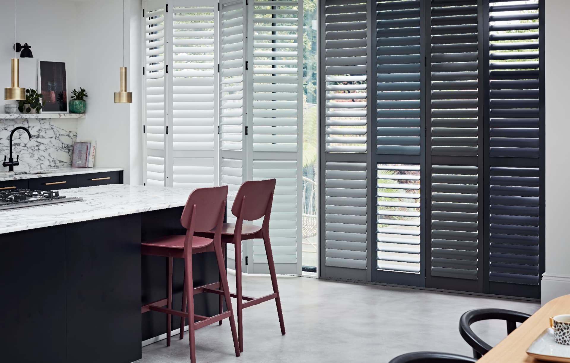 Ombré bi-fold shutter panels in the open position